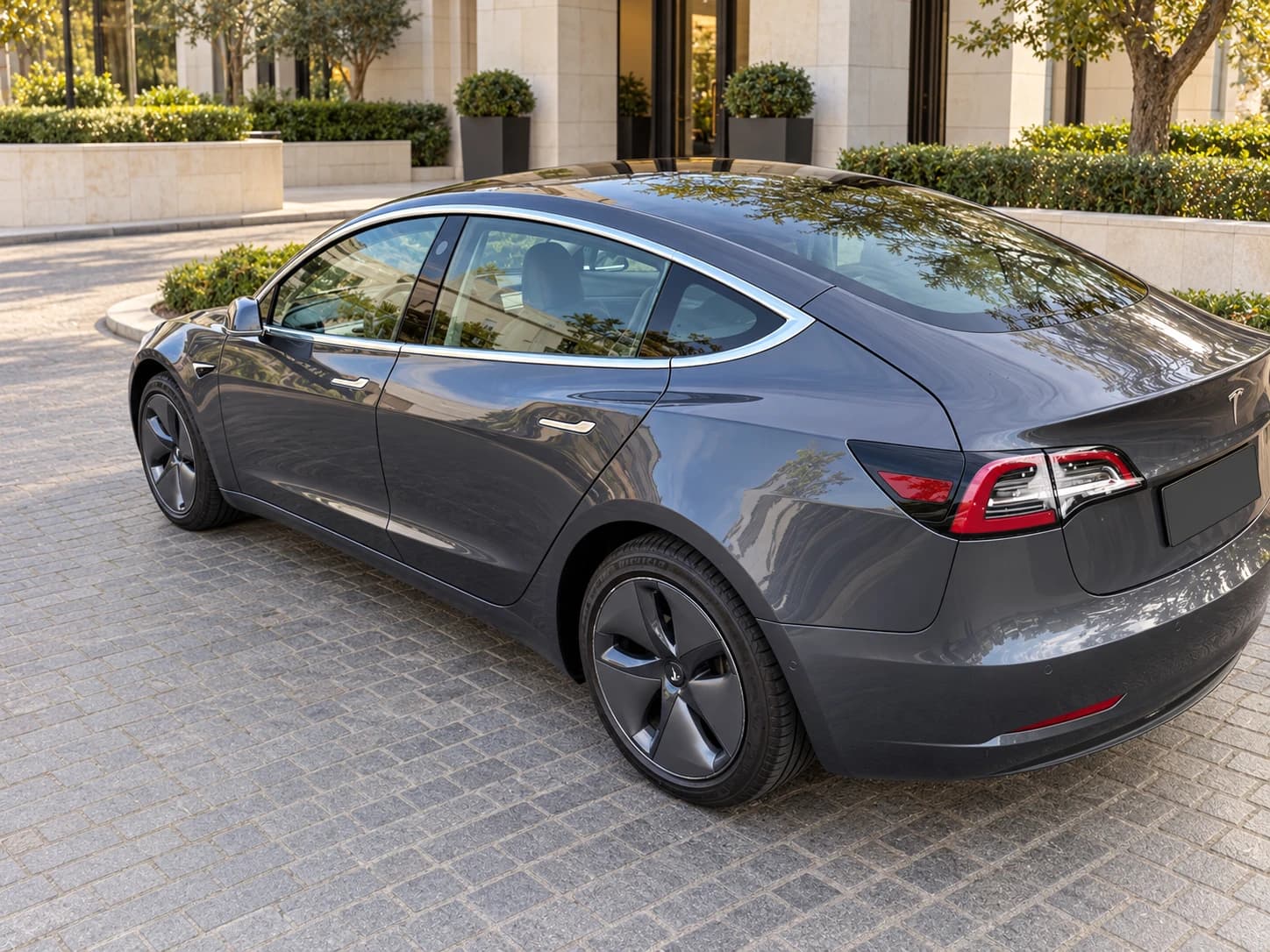 Tesla Model 3, rear three-quarter view from the left