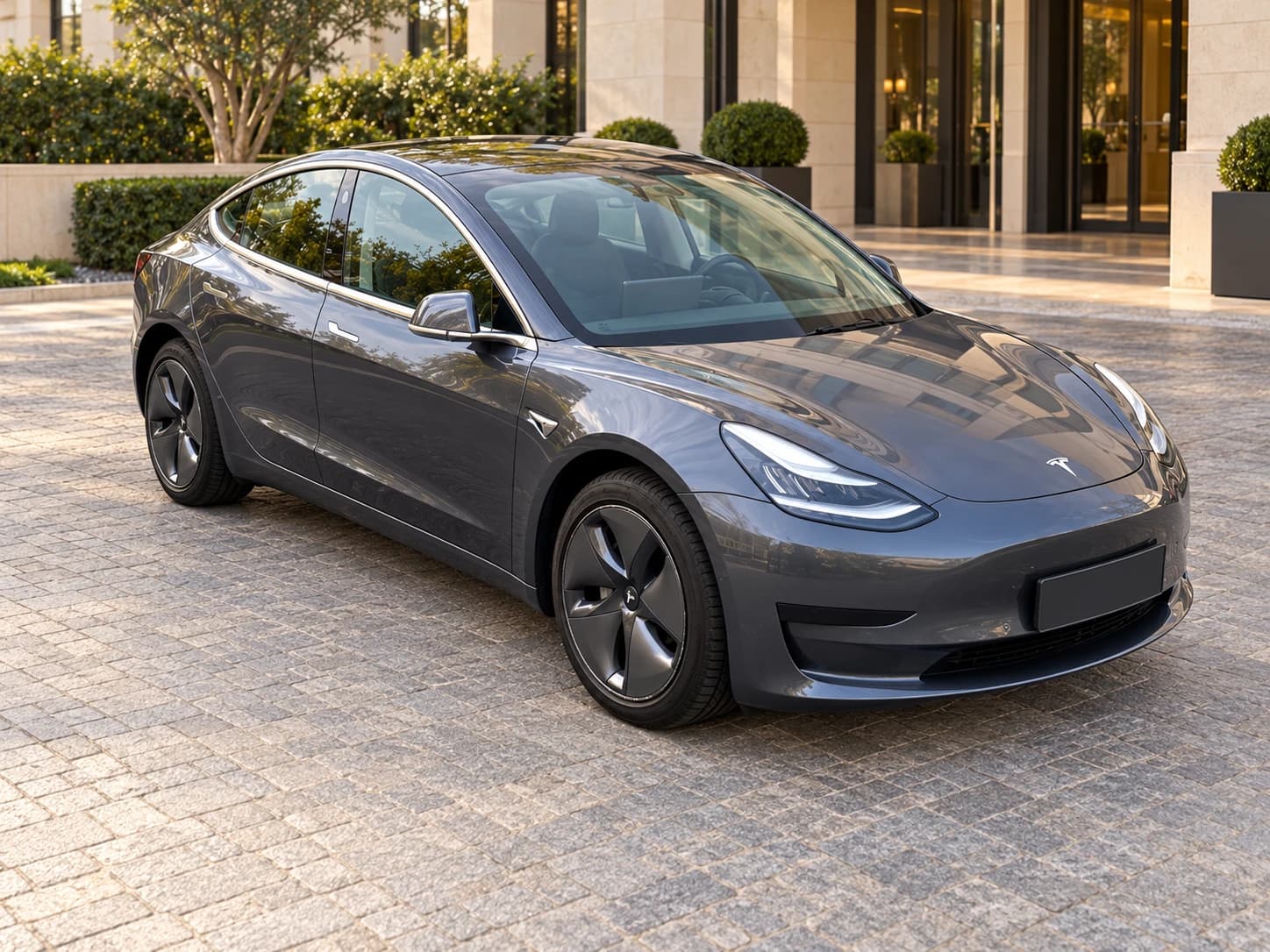 Grey Tesla Model 3, front three-quarter view